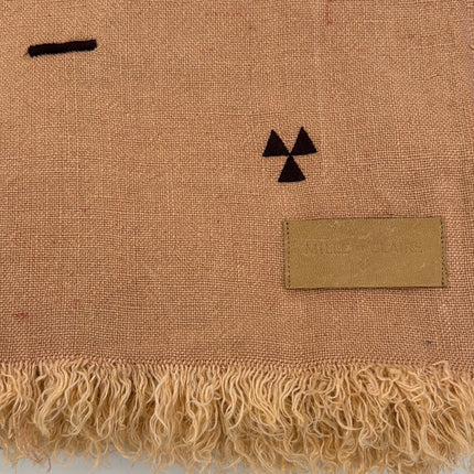 Taka Embroidered Linen Throw in Rose Madder