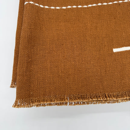 Taka Embroidered Linen Throw in Cinnamon